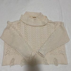 White sweater with cutouts